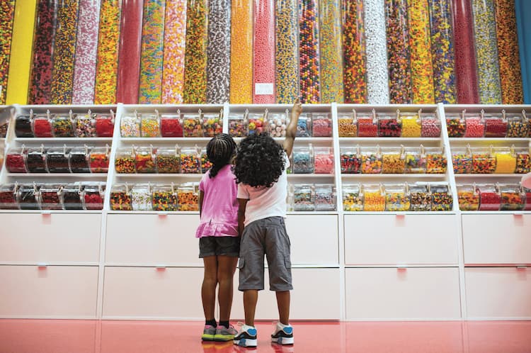 Photo - Girls pointing at candy on wall